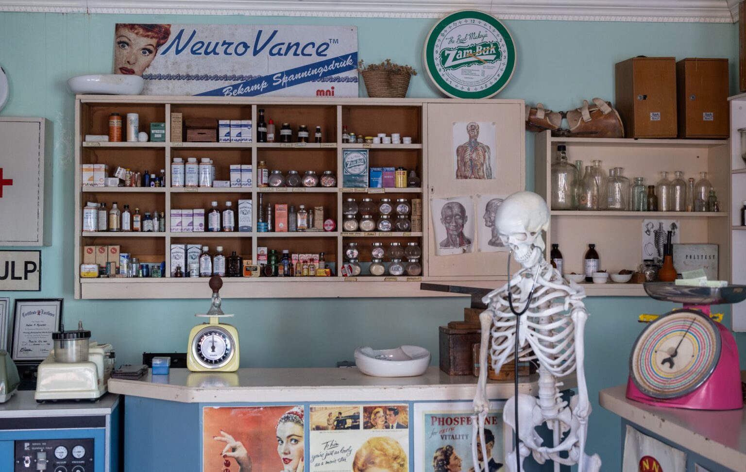 Empty retail pharmacy shelves and closed counter in an urban neighborhood