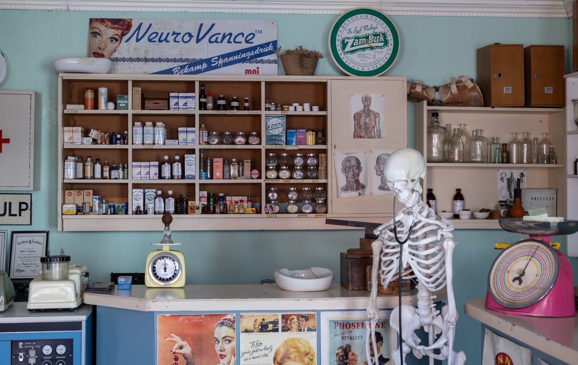 Empty retail pharmacy shelves and closed counter in an urban neighborhood