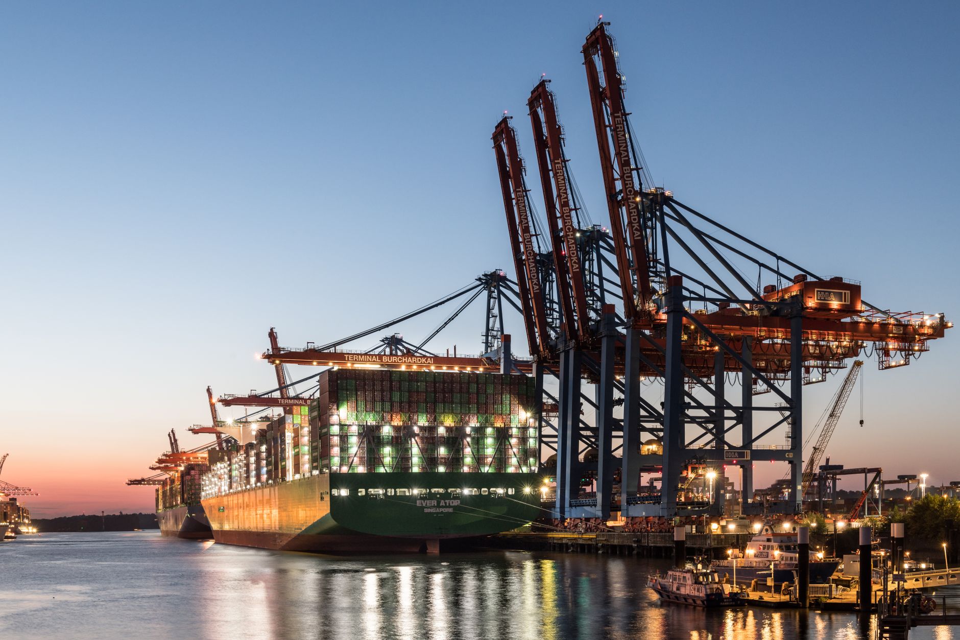 Large freight containers lined up at a commercial shipping dock