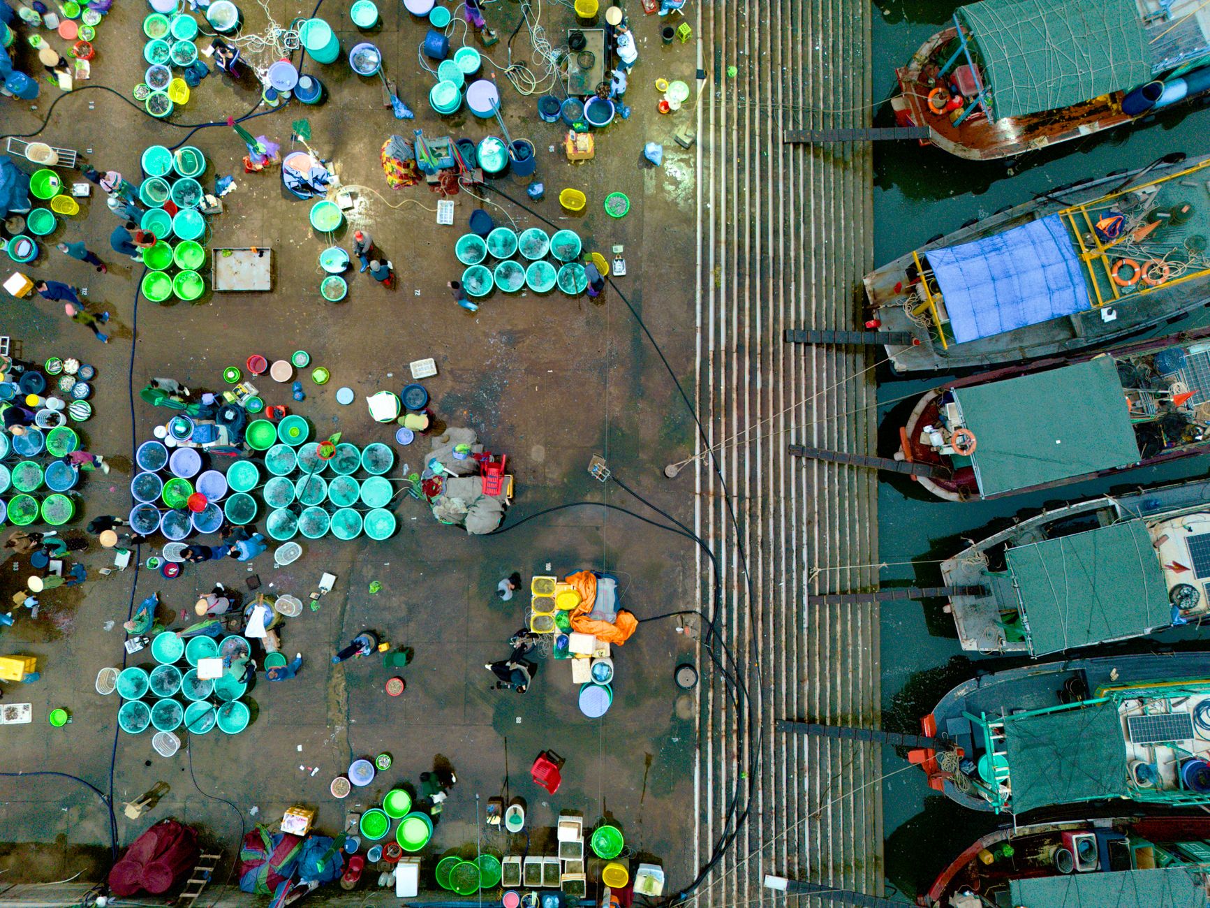 Longshoremen working on a container terminal loading freight