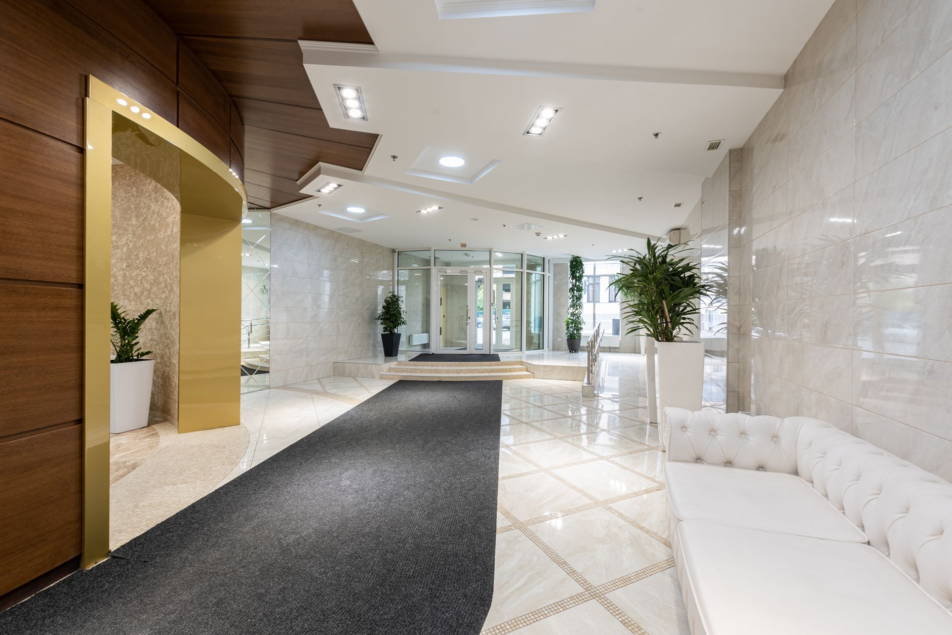 A quiet hotel lobby with no guests, representing reduced business travel occupancy