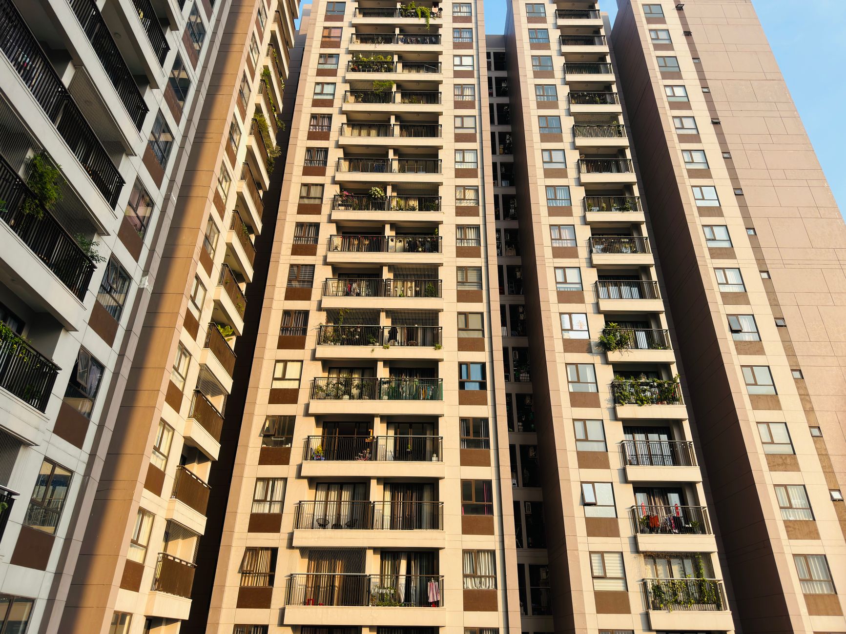 Exterior view of an affordable apartment building under construction in an urban neighborhood
