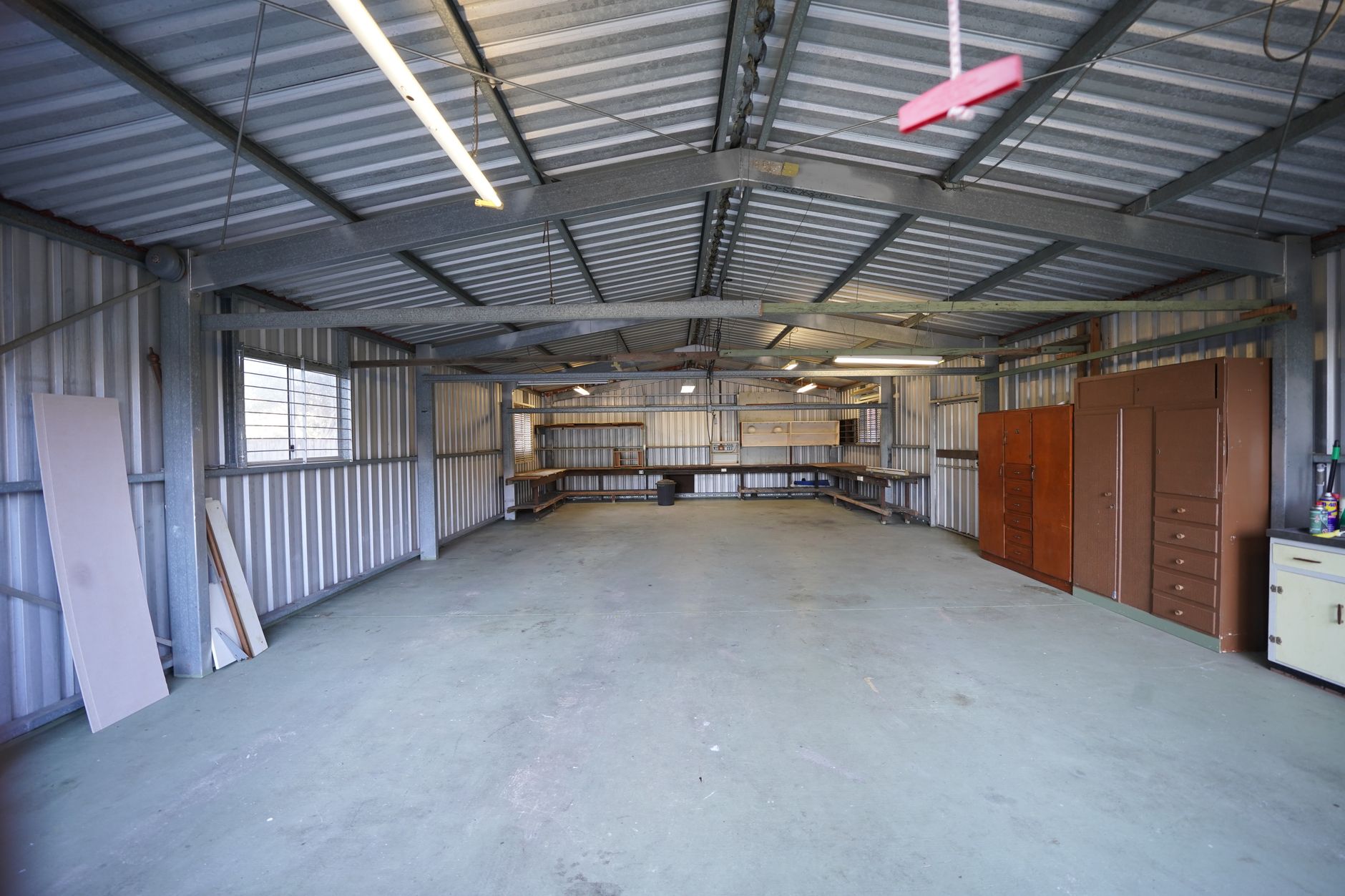 Empty manufacturing warehouse representing slowed production at a defense supplier