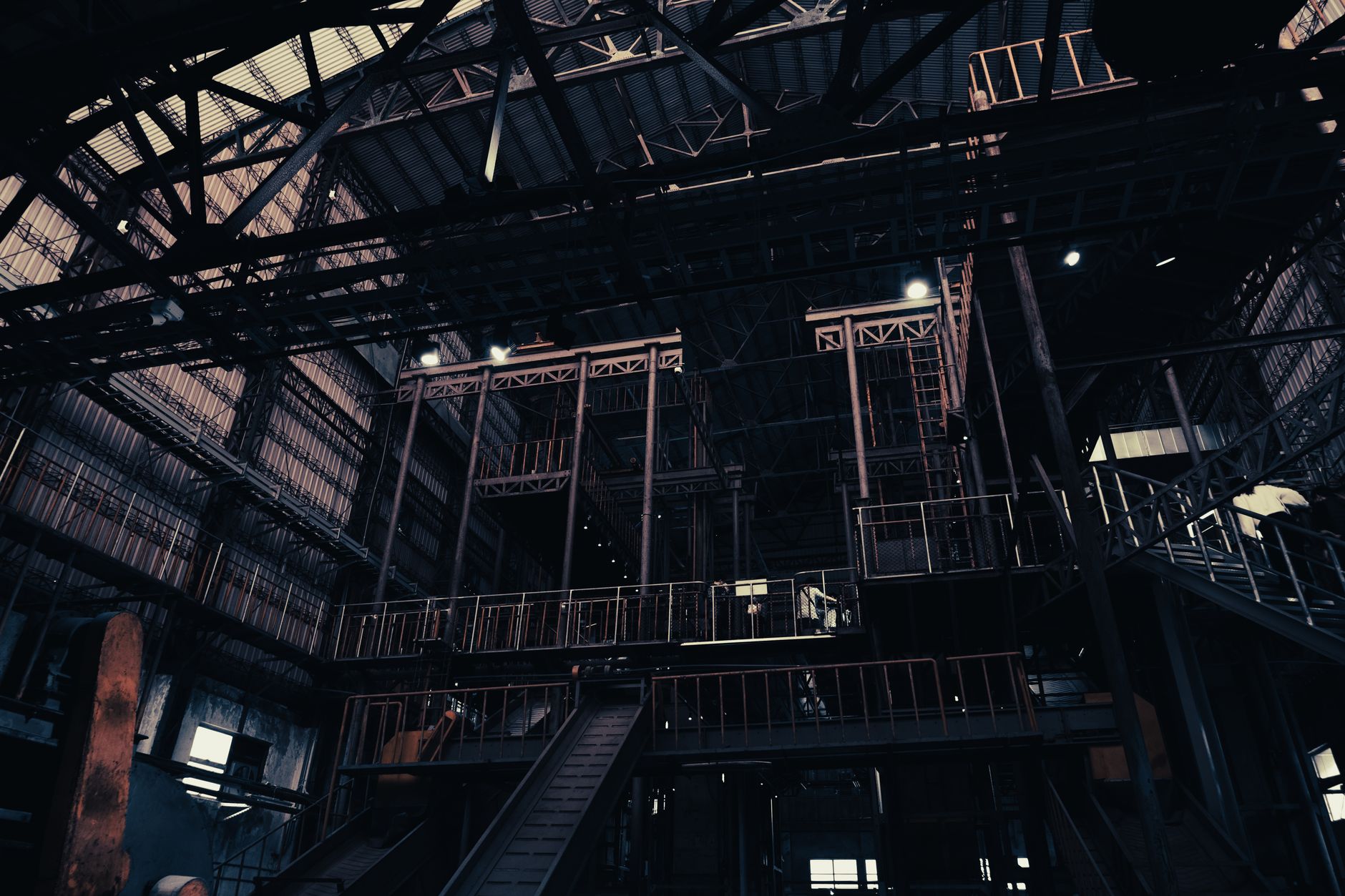 Interior of a large industrial manufacturing plant with heavy machinery