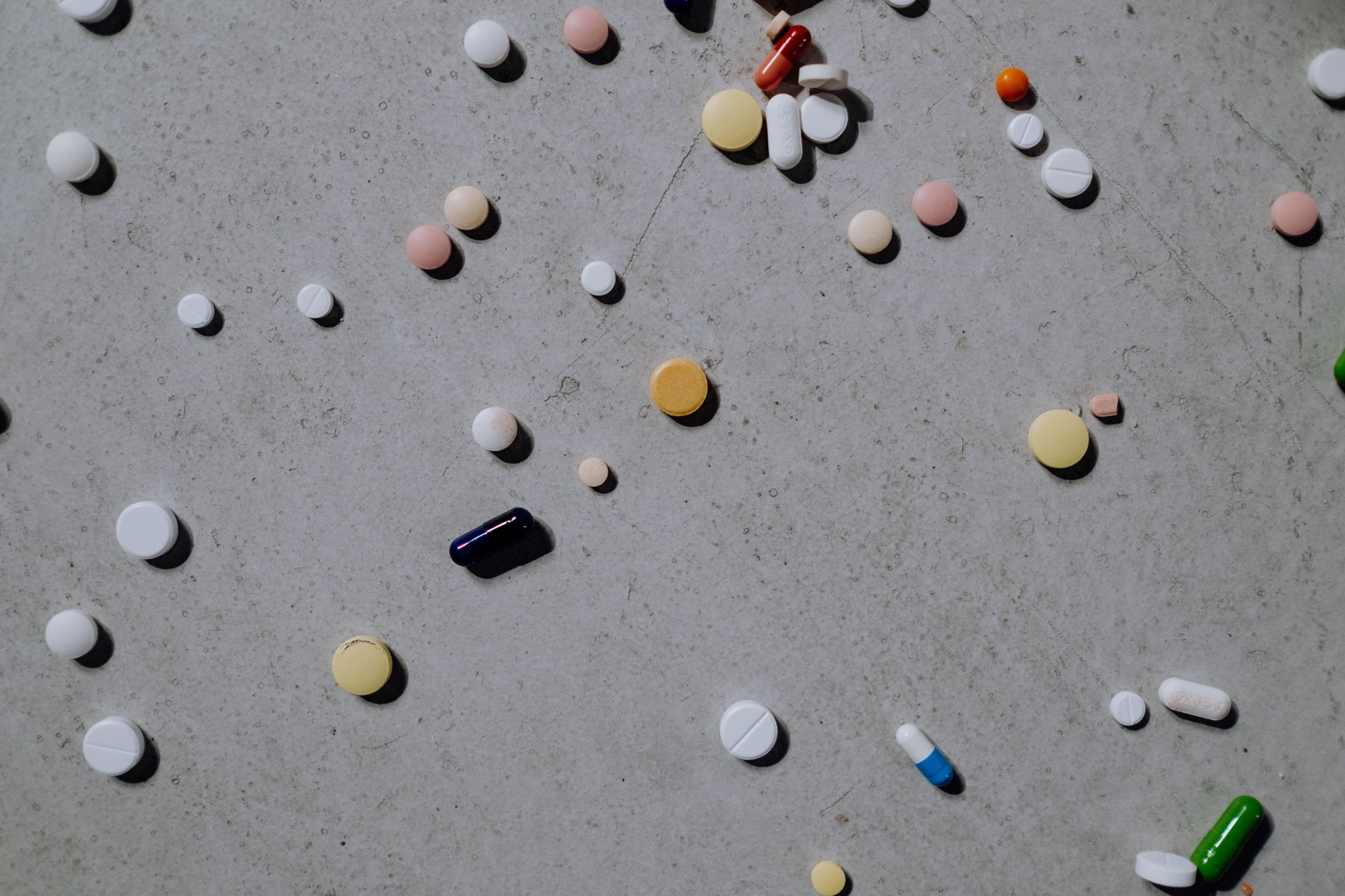 Prescription medication bottles on a pharmacy counter
