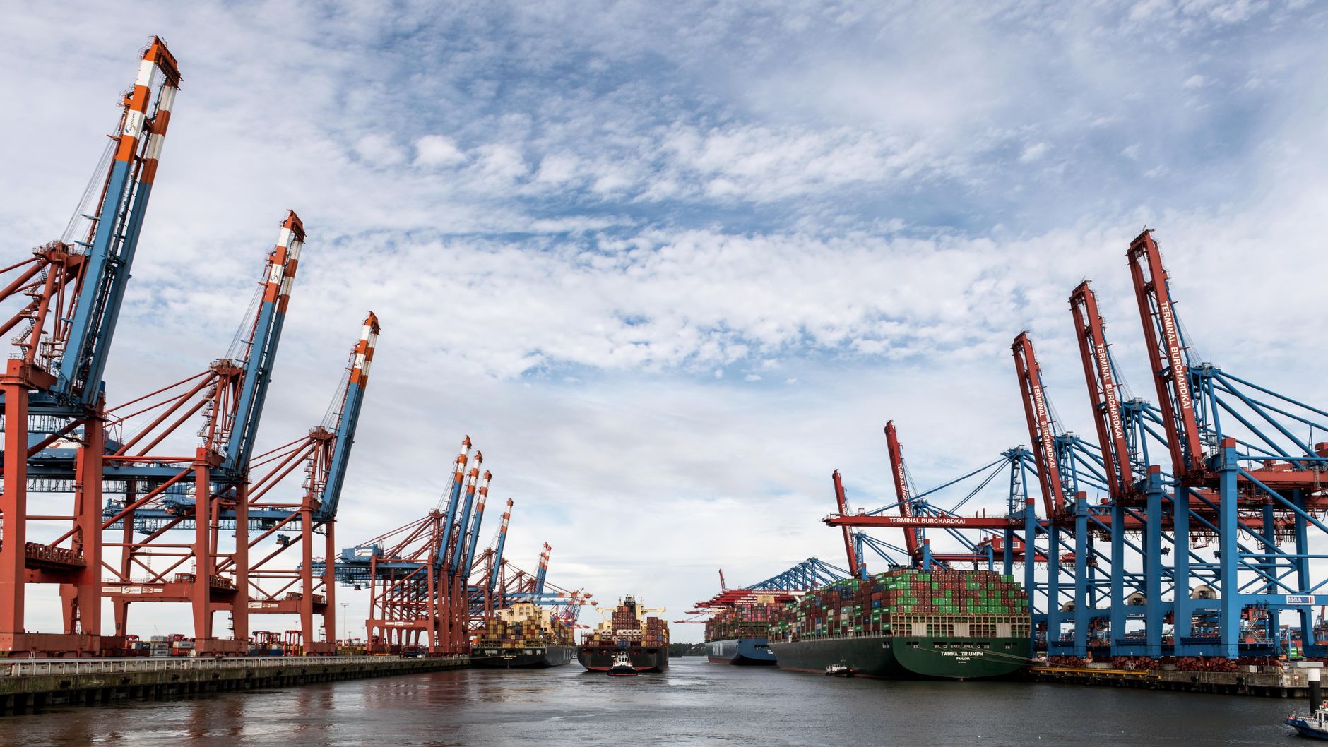 Container cargo stacked at a port terminal reflecting slowing export trade