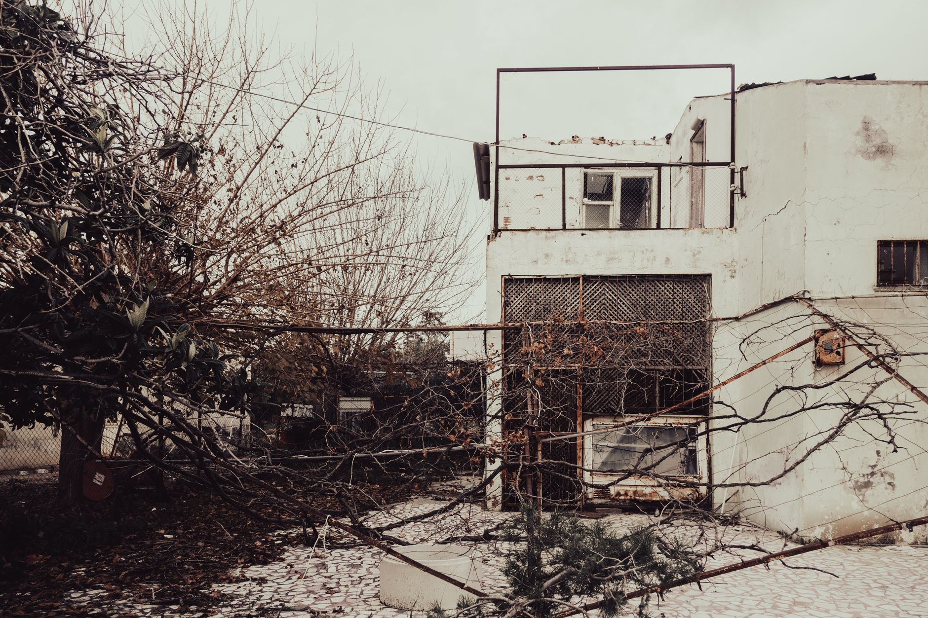 Exterior of a house with visible flood and storm damage