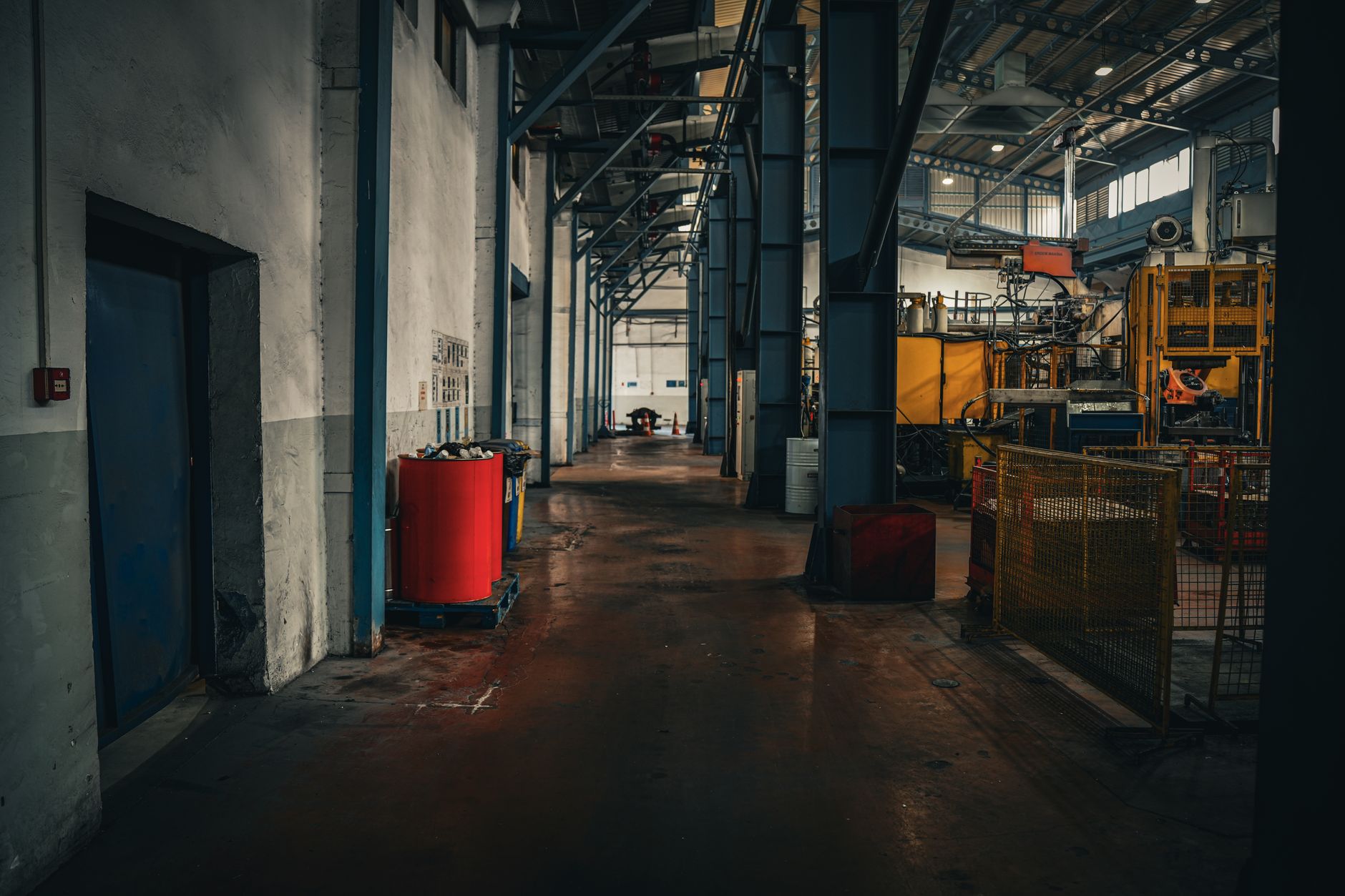 Interior of a manufacturing facility showing production equipment, reflecting industrial demand conditions