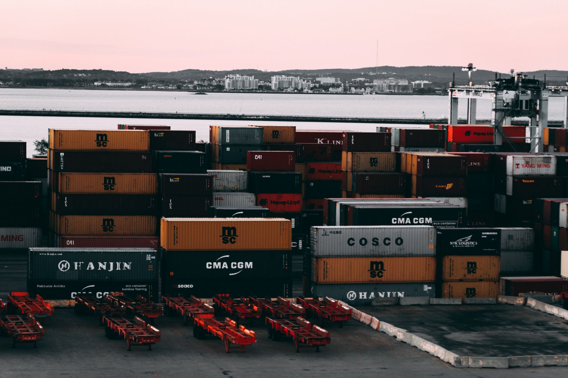Trucks lined up at a freight loading dock waiting to receive cargo