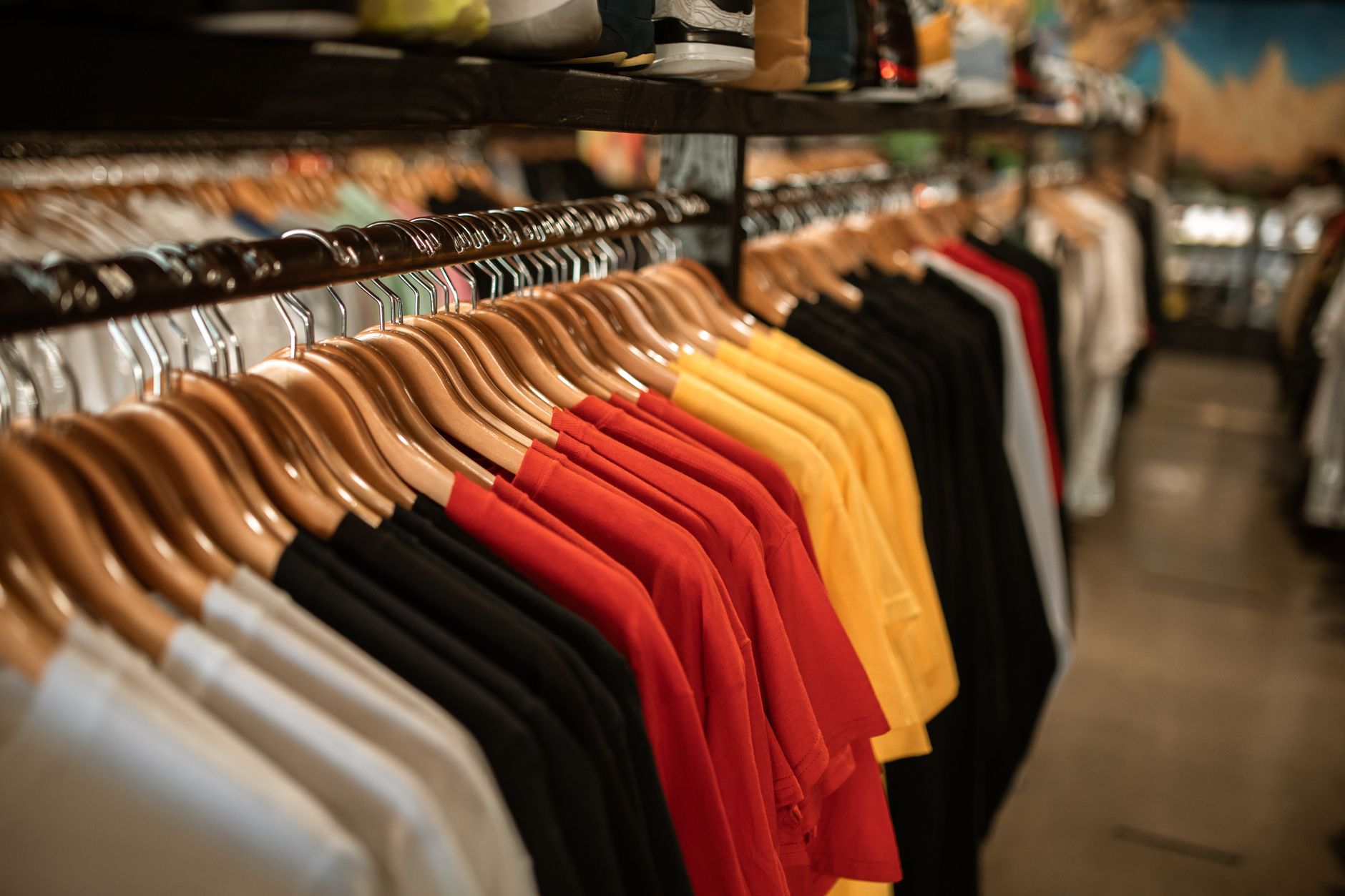 Racks of clothing displayed in a retail apparel store