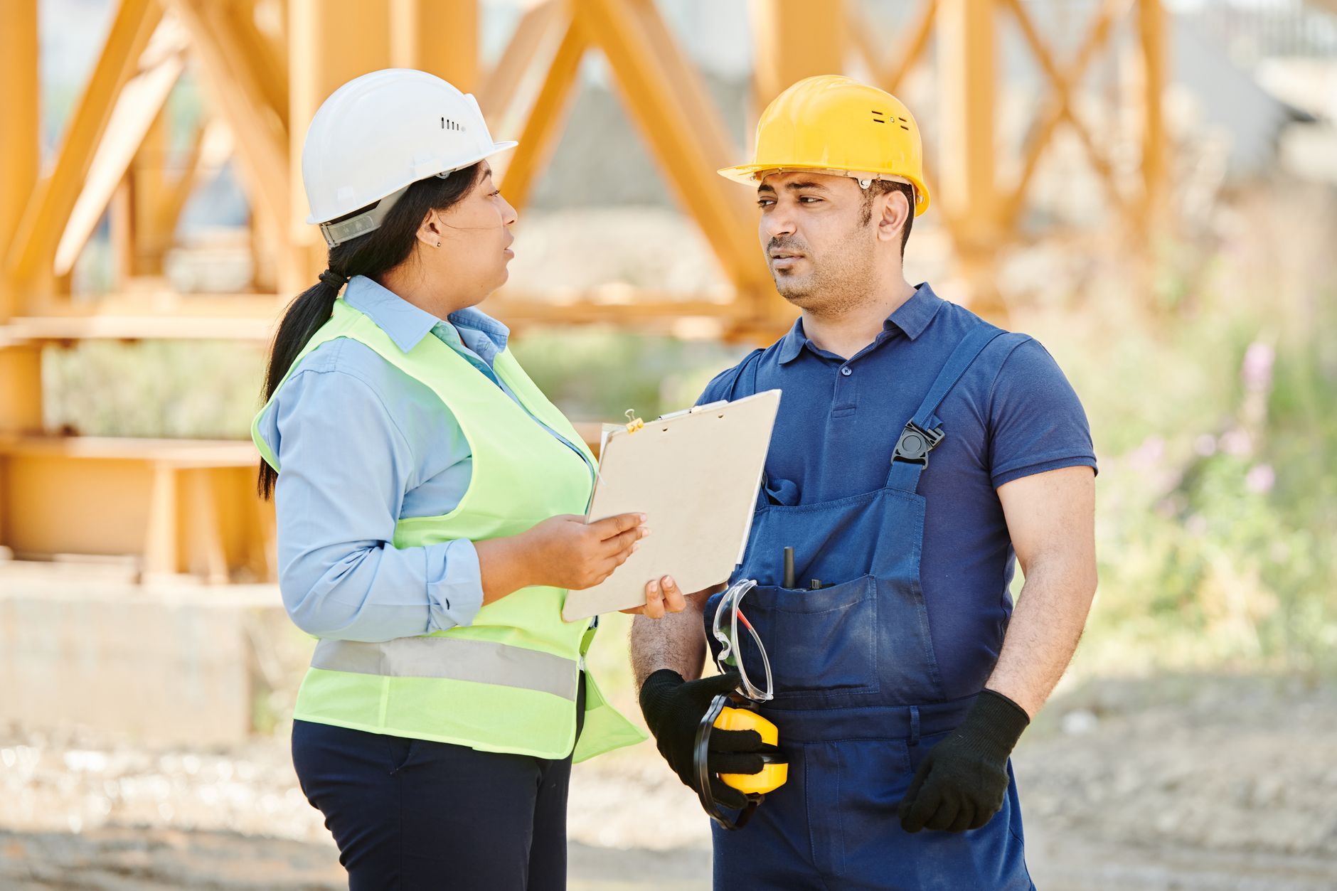 Workers in a government contractor office environment representing the workforce affected by federal procurement slowdowns