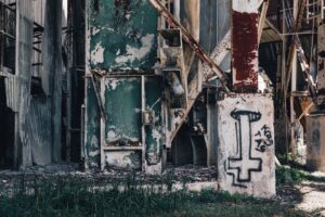 Municipal Bond Downgrades Quietly Cluster in Shrinking Midwest Cities Abandoned industrial factory building in a shrinking Midwest city reflecting economic decline