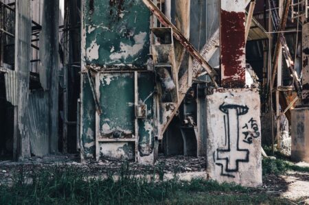 Municipal Bond Downgrades Quietly Cluster in Shrinking Midwest Cities Abandoned industrial factory building in a shrinking Midwest city reflecting economic decline