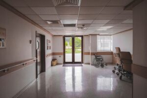 Empty hospital corridor representing healthcare staffing and Medicaid billing challenges
