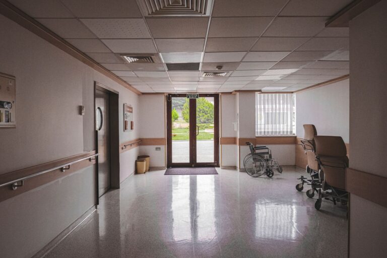 Empty hospital corridor representing healthcare staffing and Medicaid billing challenges