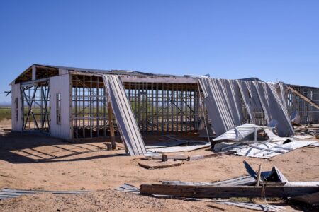 An idle construction site with unfinished structures and no visible workers