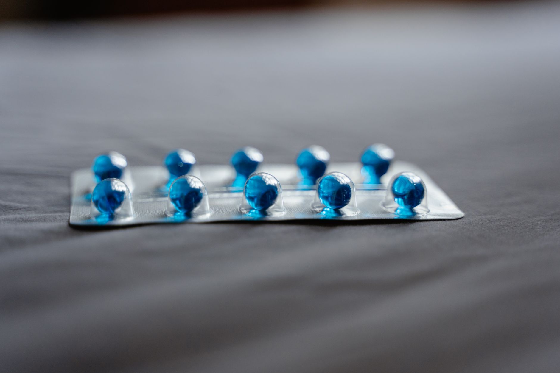 Close-up of prescription medication bottles representing drug cost management in employer health plans