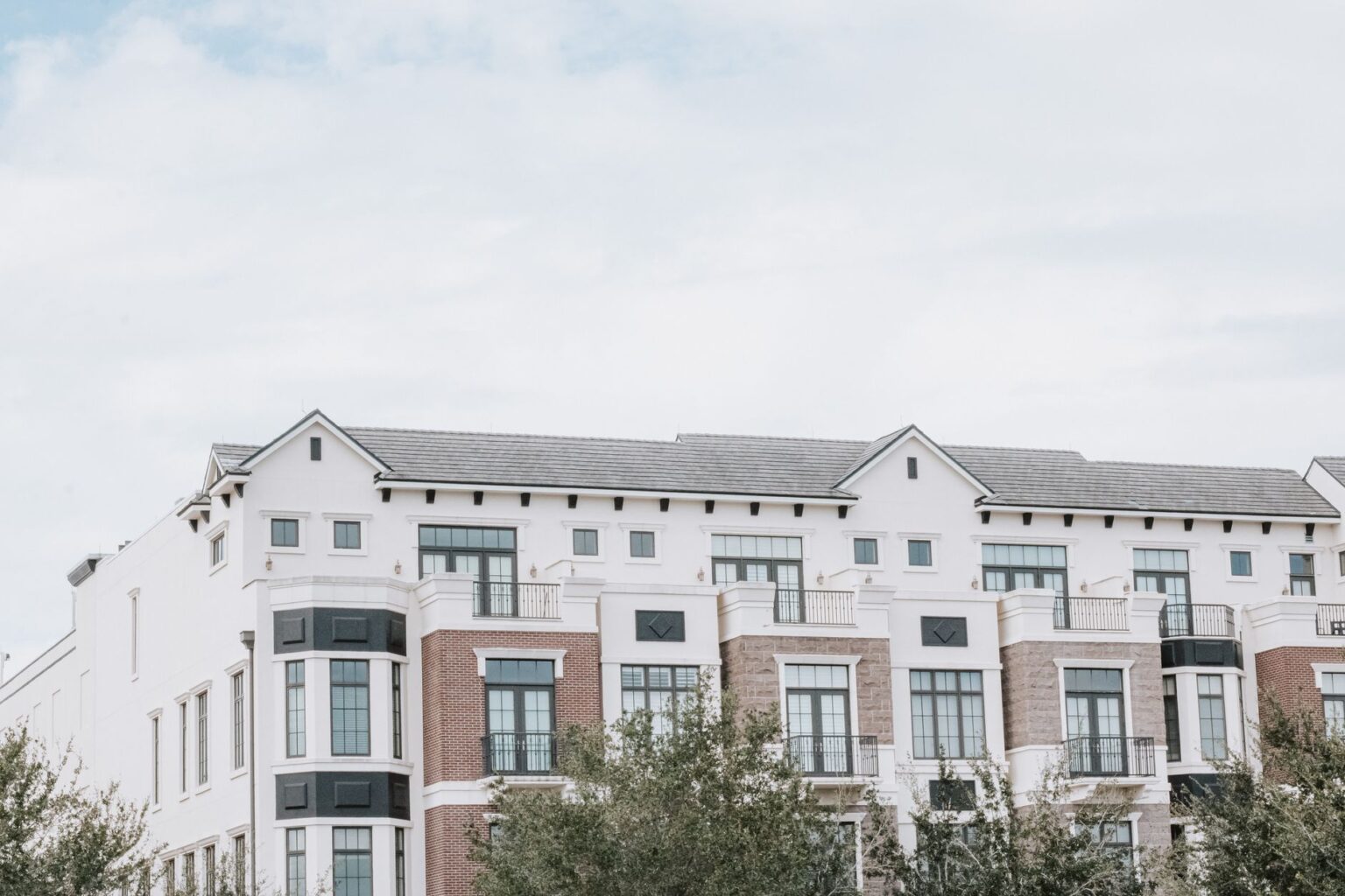 Section 8 Voucher Backlogs Deepen as HUD Construction Subsidies Stall Exterior of a residential apartment building representing affordable housing stock