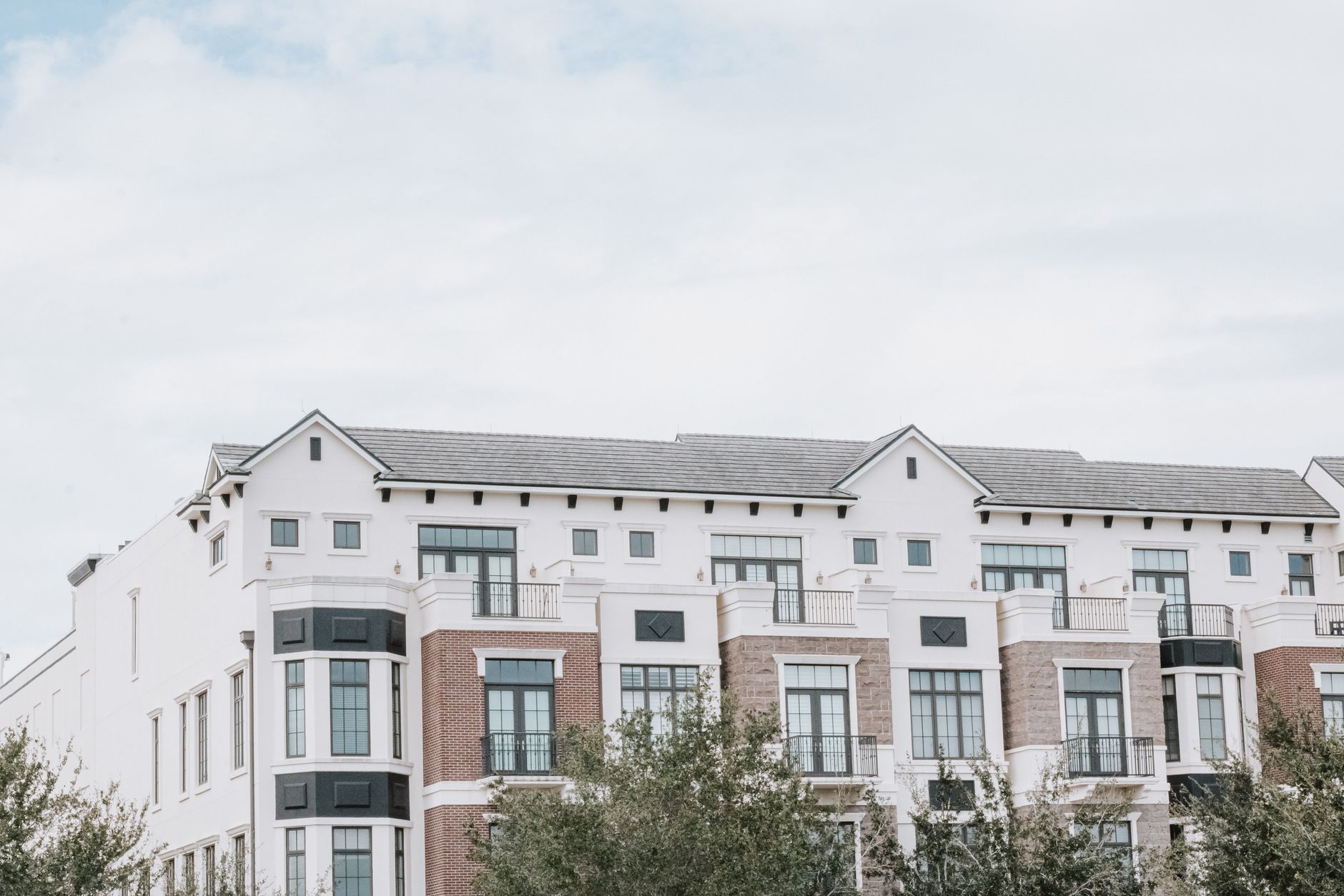 Exterior of a residential apartment building representing affordable housing stock