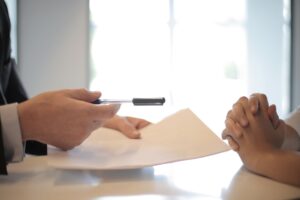 Student Loan Servicer Exits Quietly Disrupt Borrower Repayment Pipelines Person reviewing student loan documents at a desk