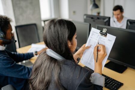 Federal office workers at desks inside a government building