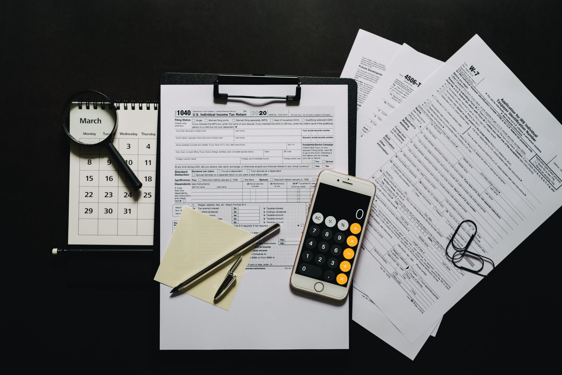 Financial audit documents spread on a desk representing state Medicaid review processes