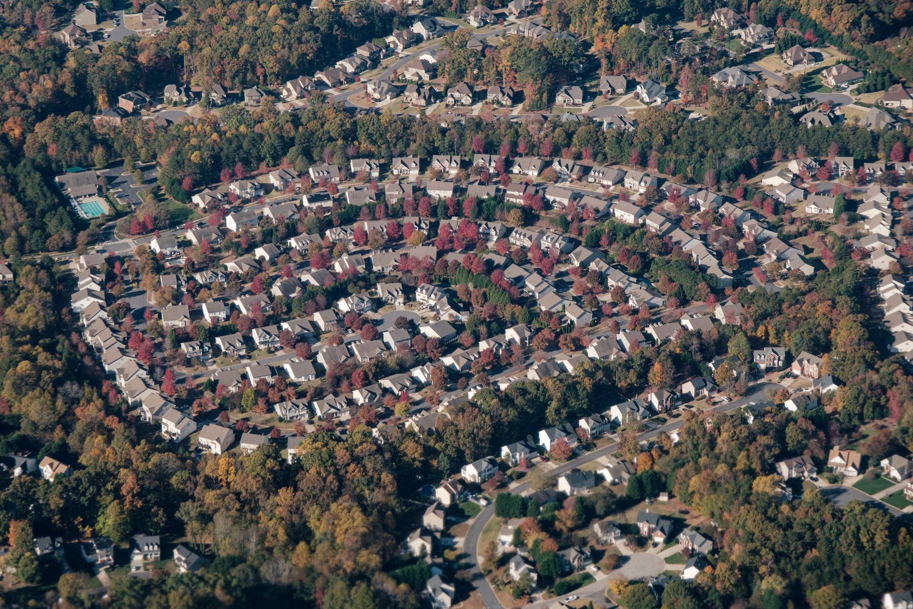 Aerial photograph of a large residential housing development in a Sun Belt suburb