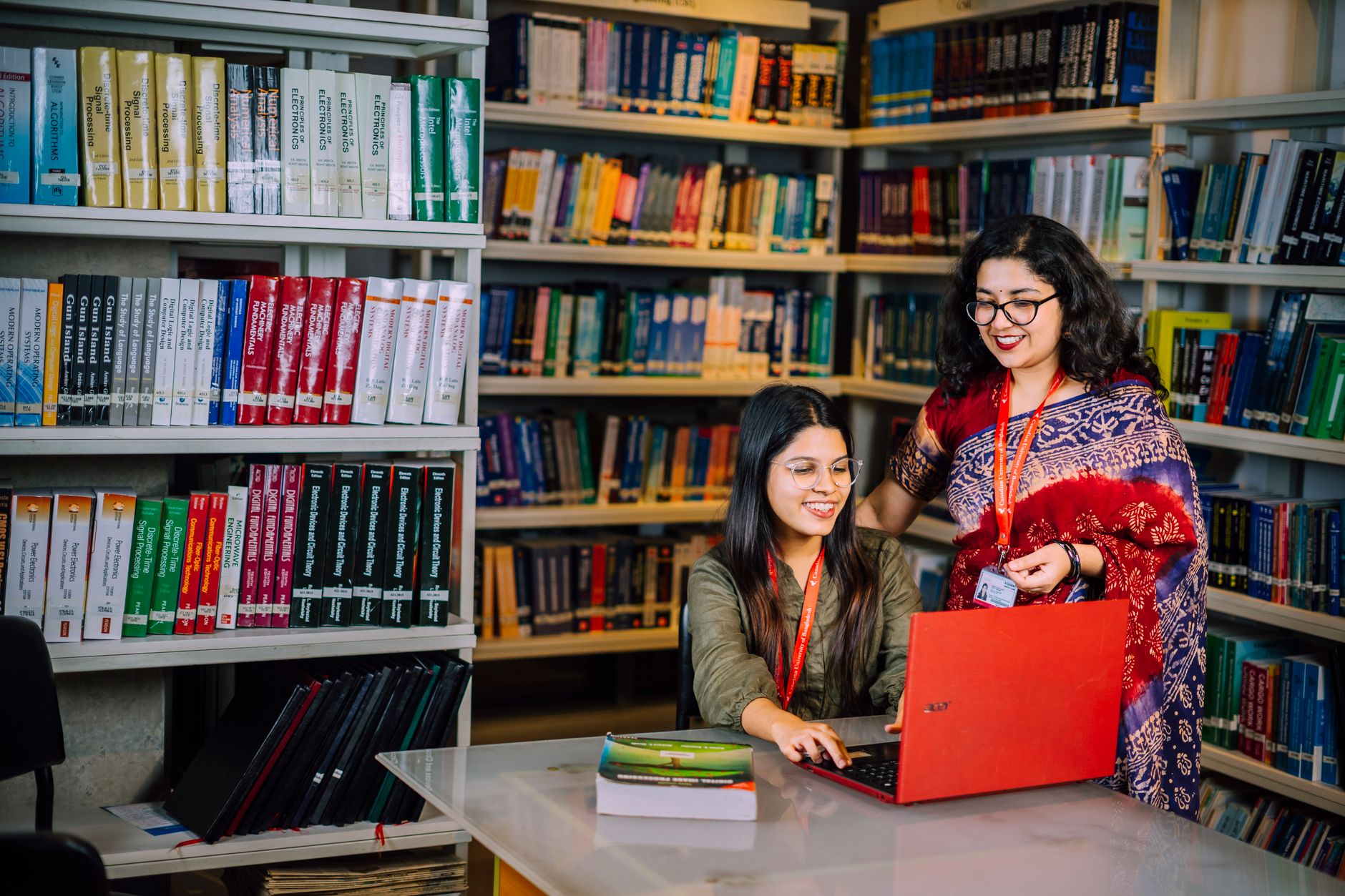 A college student reviewing financial aid documents at a desk
