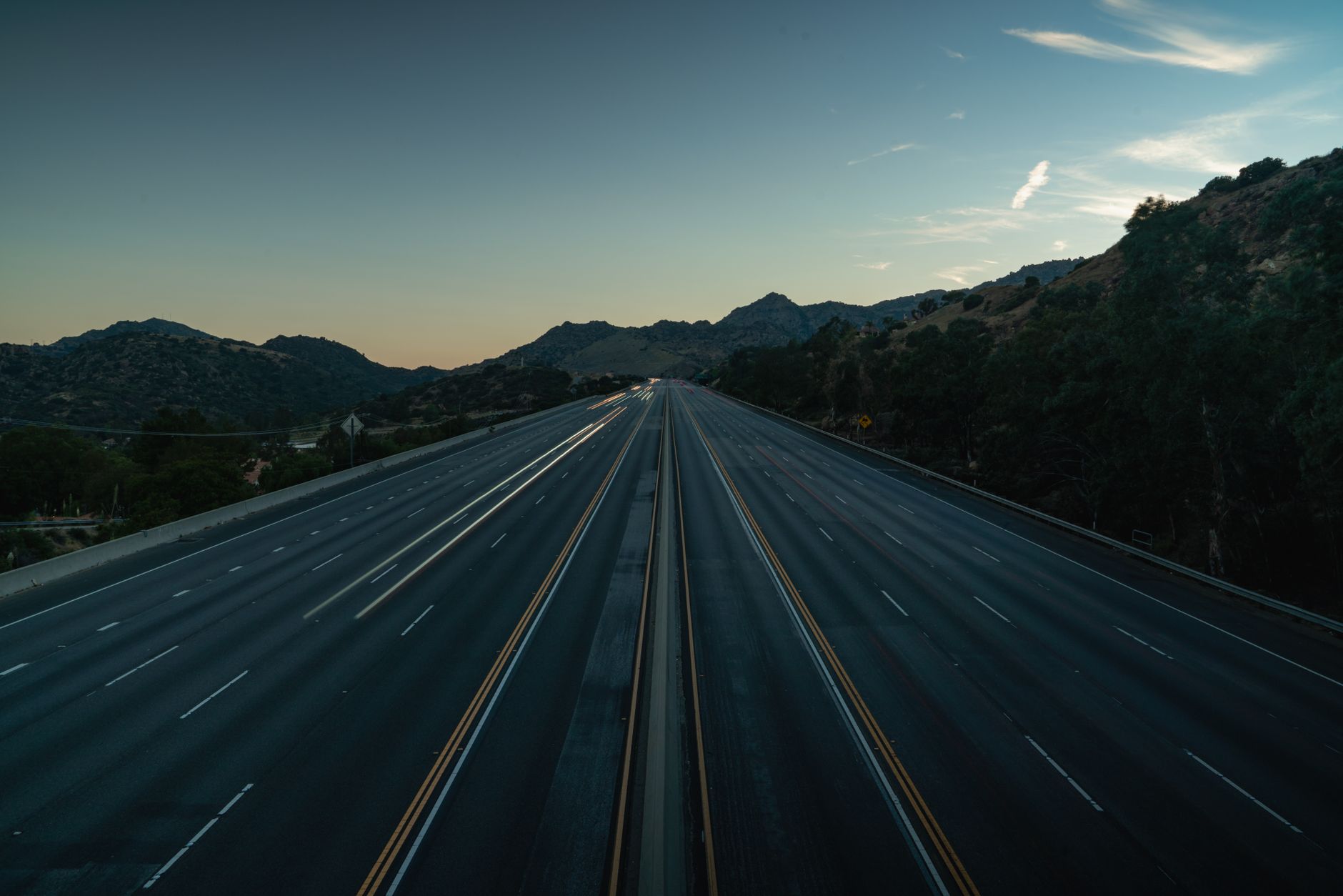 Empty suburban road representing lack of transportation access