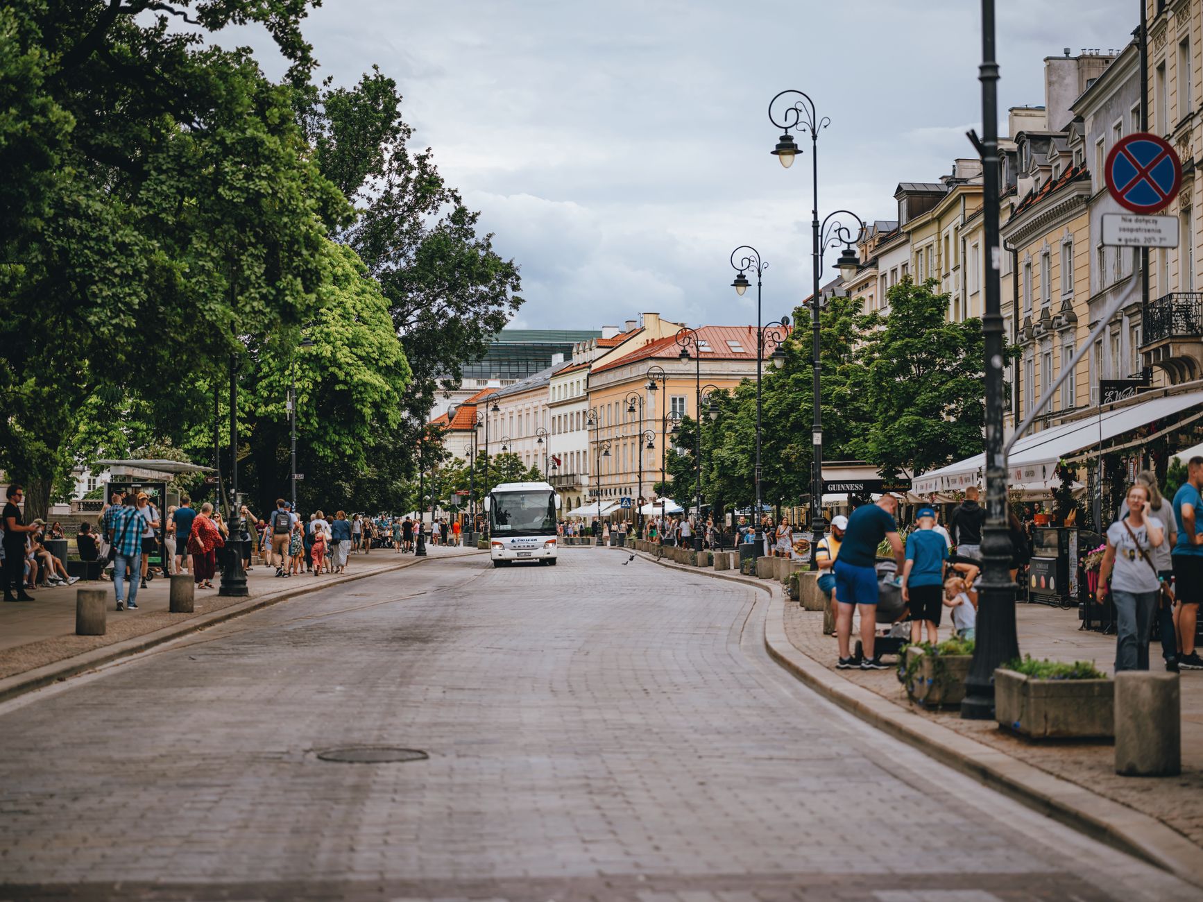 Public transit bus traveling along a city street