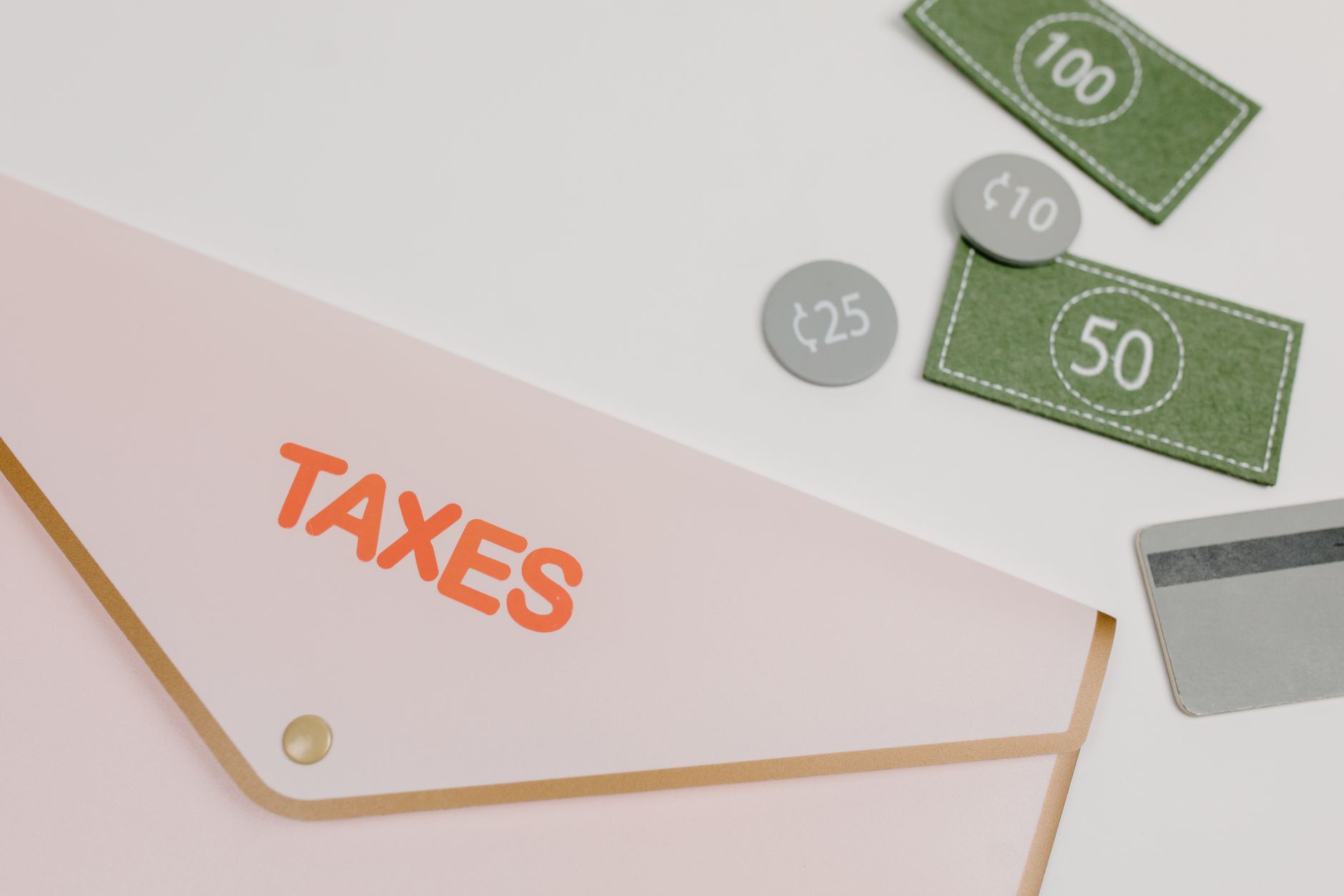 Financial documents and budget spreadsheets spread across a government office desk