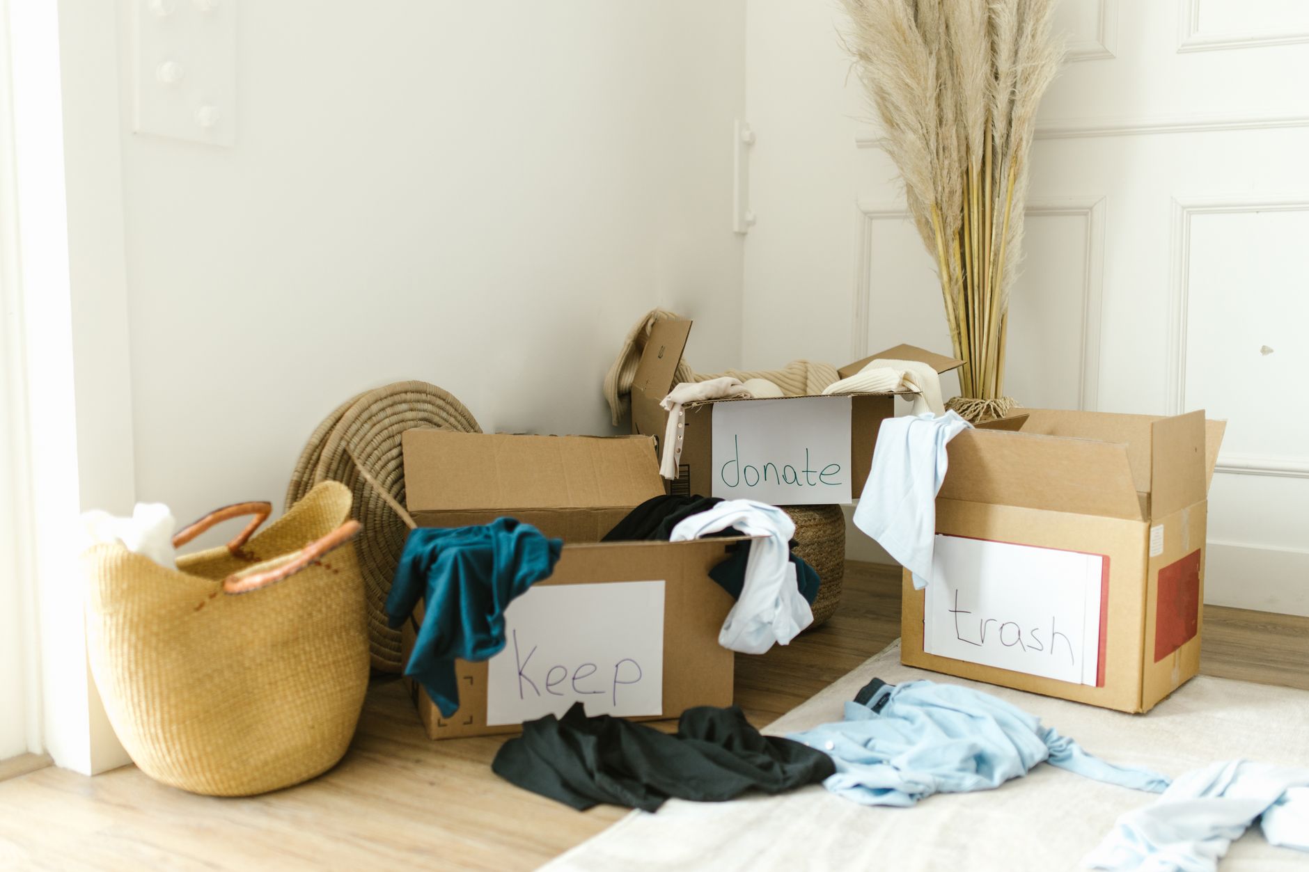 Cardboard boxes filled with household donations at a drop-off center