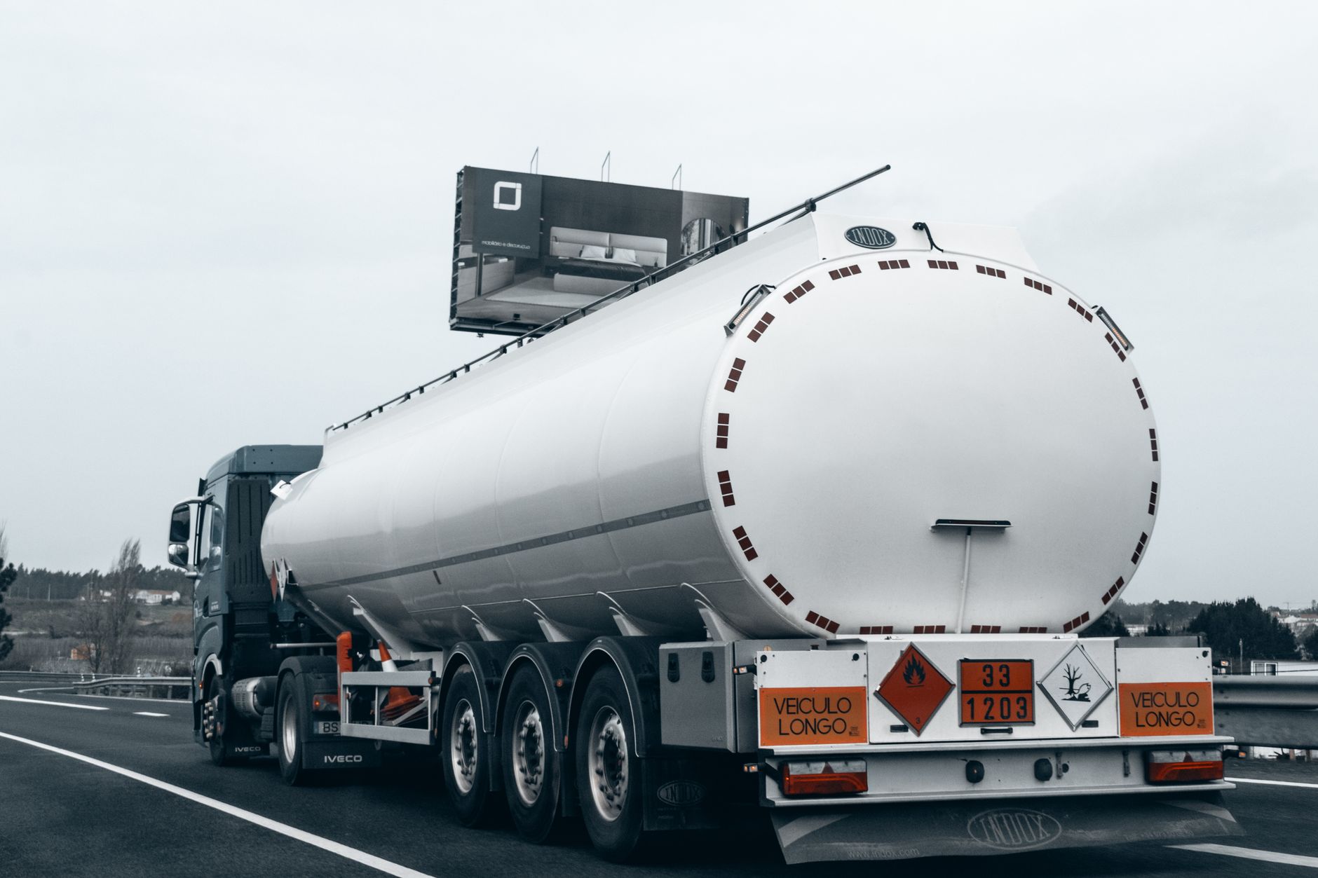 Heavy-duty diesel freight truck driving on a highway