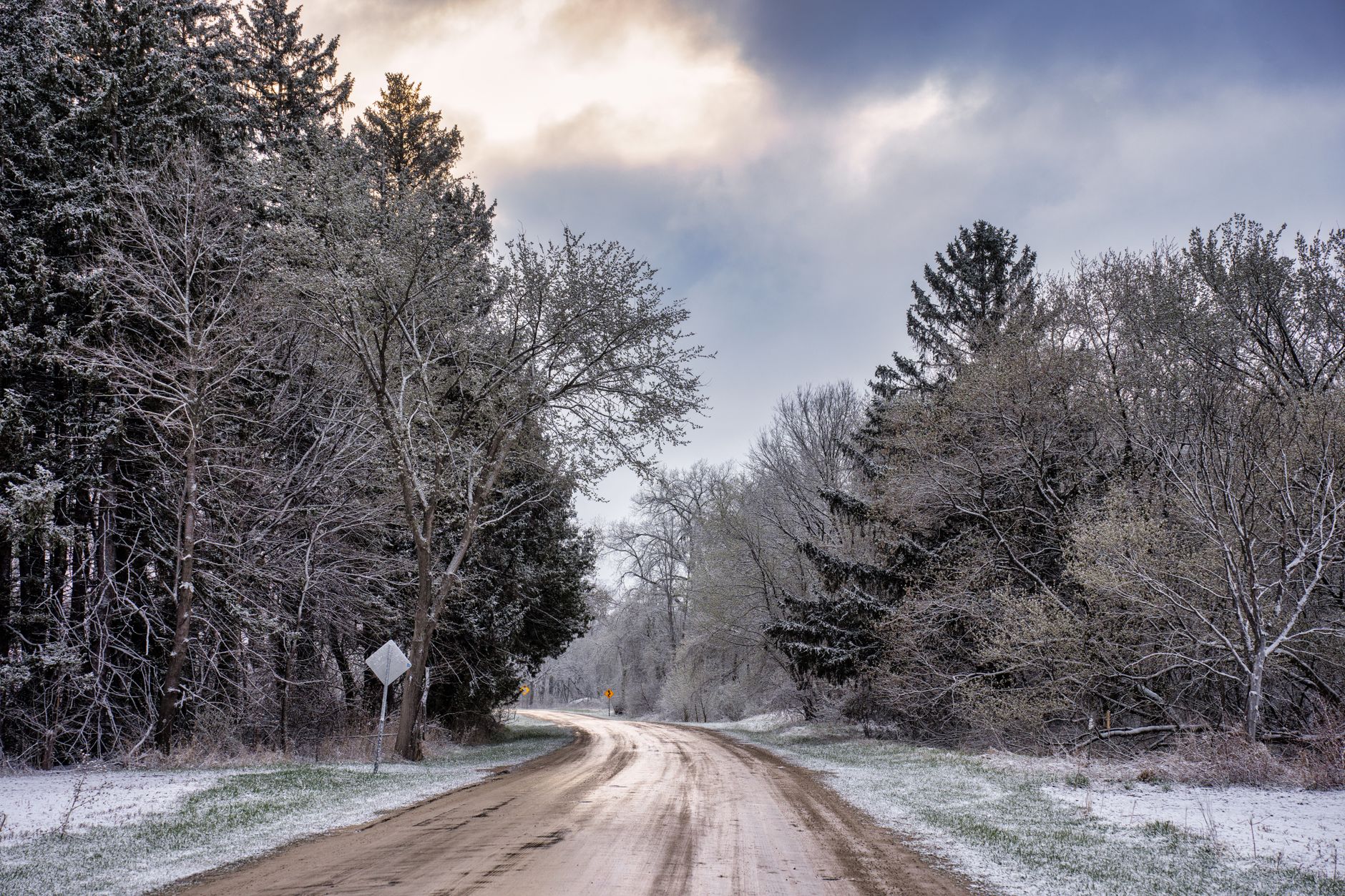Isolated rural road in winter conditions with no buildings in sight