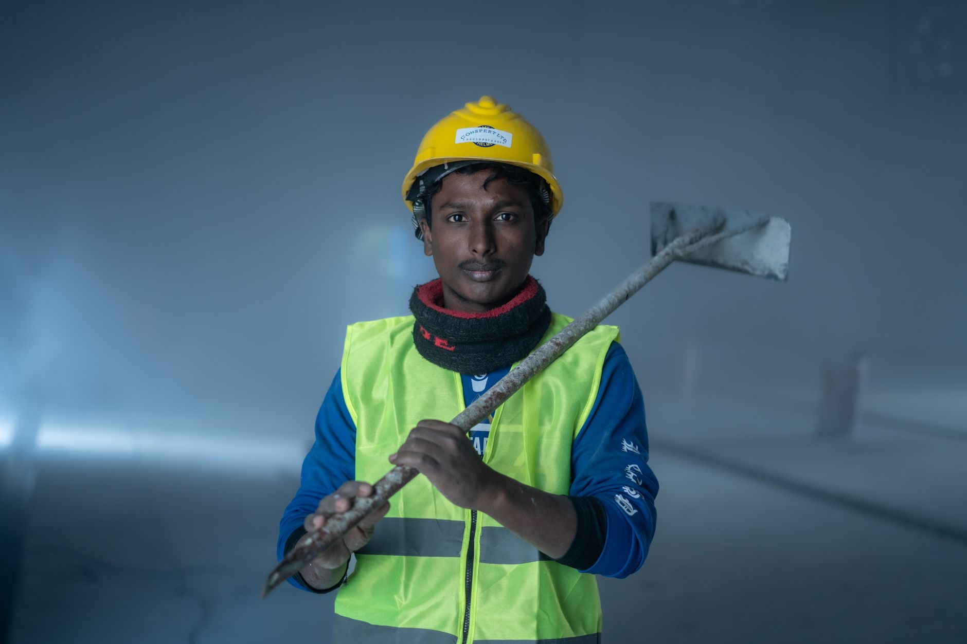 An independent contractor reviewing paperwork at a job site with tools nearby