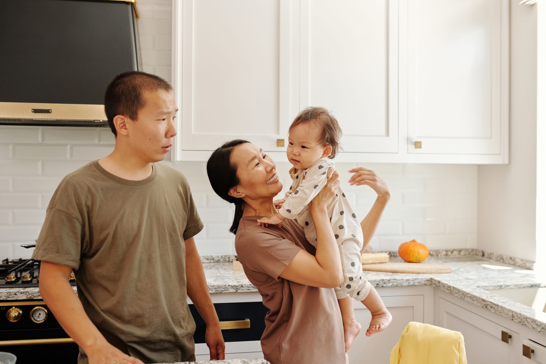 Family in a modest kitchen, representing households facing energy insecurity