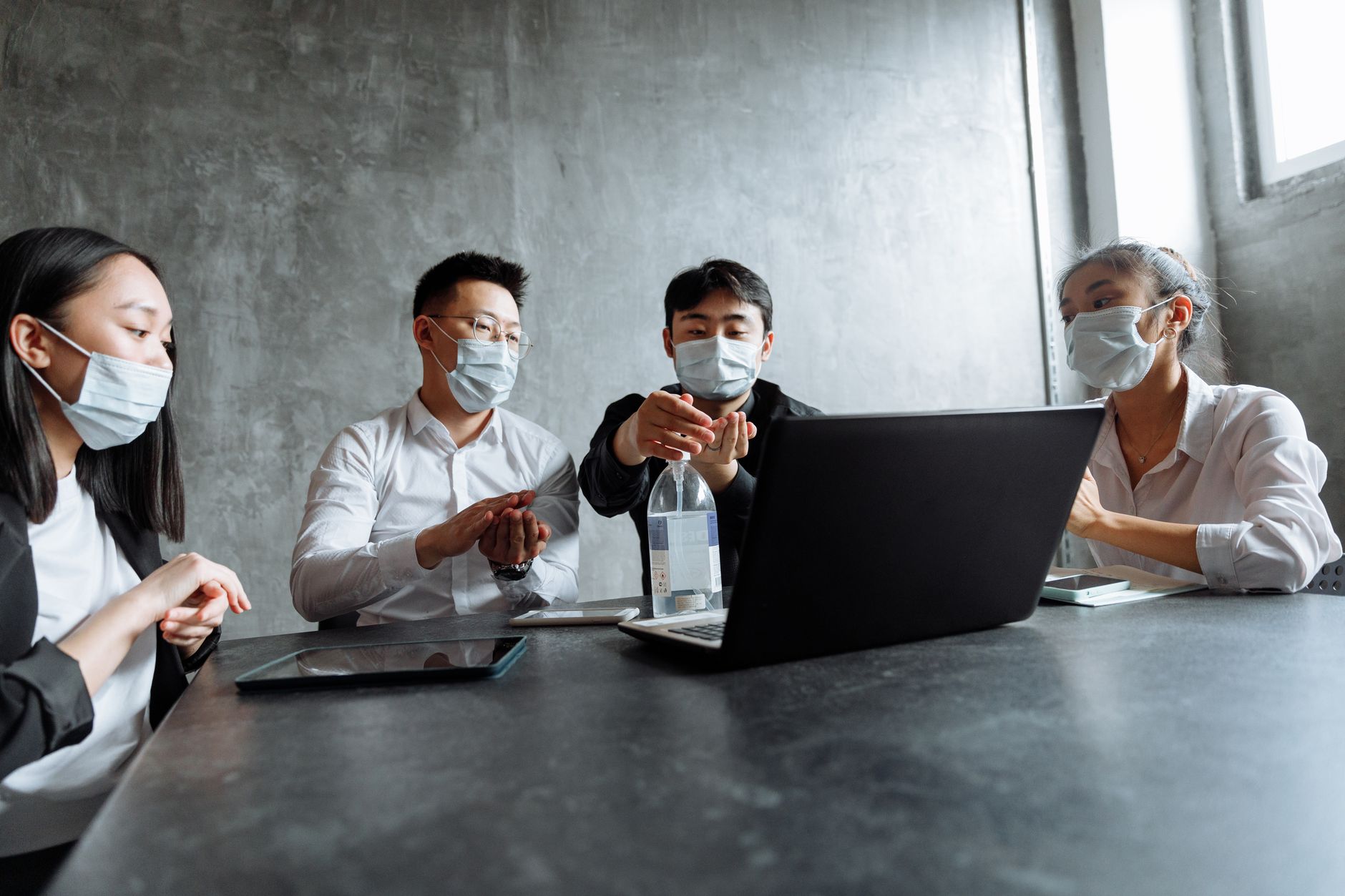 Healthcare professionals reviewing financial documents in a business meeting